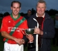 Ned Moran (Chairman, Northern Board) presents Ger Doyle (Captain, St. Martins) with the Northern Junior \'A\' Cup after they defeated Clara in the Final.