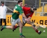 Striding out - St. Martin\'s Shane Cadogan struggles for the sliotar with Glenmore\'s Michael Phelan during their clash in Nowlan.